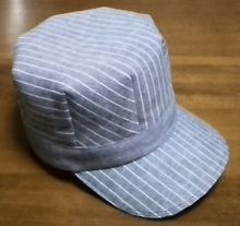 a white hat sitting on top of a wooden table