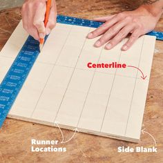 a person is cutting up a piece of wood with a ruler on it and the words centerline written in red