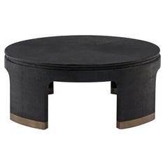 a black coffee table with two brown legs