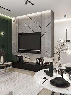 a living room filled with furniture and a flat screen tv mounted to the side of a wall