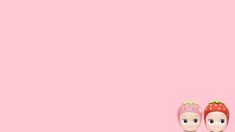 two little dolls are standing next to each other on a pink background with space for text