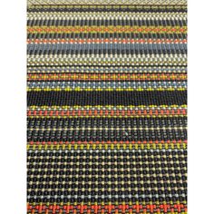 a multicolored rug with black, yellow and red stripes