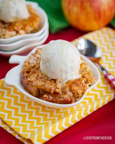 an apple crisp with ice cream in a bowl