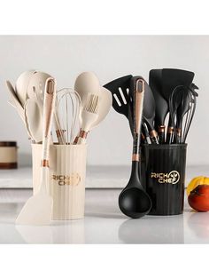 kitchen utensils are sitting in a cup on the counter