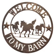 a metal sign that says welcome to my barn with three horses running in the background