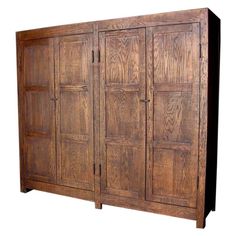 a large wooden cabinet with four doors