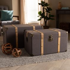 three pieces of luggage sitting on top of a rug