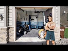 a man standing in front of a garage with his arms crossed