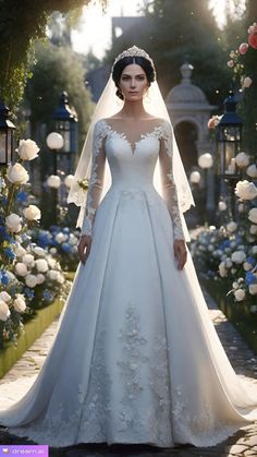 a woman in a wedding dress standing on a path surrounded by white roses and flowers