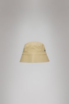 Bucket Hat is Rains' take on the classic headwear icon with new interpretations. The Bucket Hat is characterized by a lower and more vertical rim, finished with stitch details. The design is lined with a soft breathable fabric for improved comfort and fit. Bucket Hat is cut from Rains' signature PU fabric. The finish is lightweight with a smooth feel. Sand Bucket, Pu Fabric, Navy And Green, Black And Navy, Over 50, Breathable Fabric, Bucket Hat, Couture, Hats