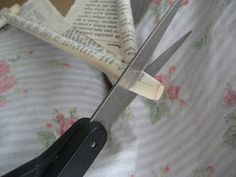 a pair of scissors cutting through the fabric