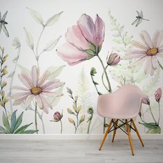 a pink chair sitting in front of a wall with flowers on it and a dragonfly