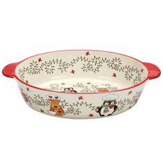 a white and red bowl with christmas decorations on the rim, in front of a white background