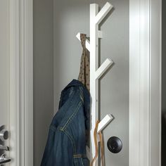 the coat rack is hanging on the wall