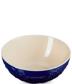 a blue and white bowl sitting on top of a table