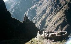 people are walking up the side of a mountain