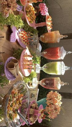 an assortment of desserts and drinks are on display at a party or wedding reception