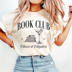 a woman wearing a book club t - shirt with a martini glass on the front