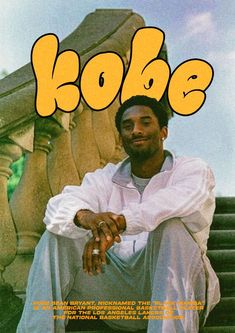 a man sitting on top of a set of stairs next to a stair case with the word kobe written across it