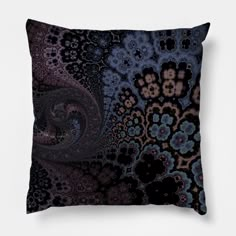 a black and blue pillow with an intricate design