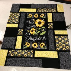 a quilt with sunflowers and the words you are my sunshine written on it