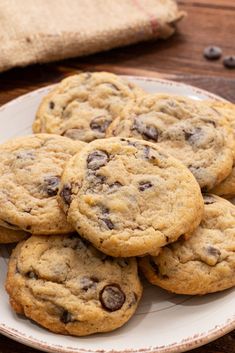 a plate full of chocolate chip cookies on a table