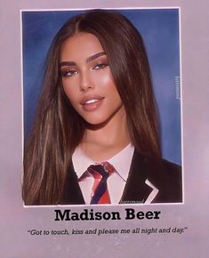 a woman with long brown hair wearing a suit and tie in front of a sign that says madison beer