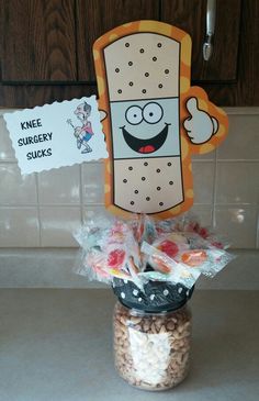 a jar filled with candy sitting on top of a counter