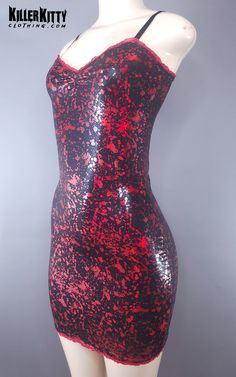 Blood splatter metallic print dress. Red mesh ruffle detailing on the neckline and hem and adjustable bra straps for the perfect fit. LENGTH: 24" - 26" armpit to hem. MATERIAL: Spandex Blood Dress Fashion, Fitted Party Dress With Skull Print, Blood Splater Shirt, Blood Drip Earrings, Blood Drip Necklace, Blood Splatter, Adjustable Bra, Metallic Prints, Bra Straps