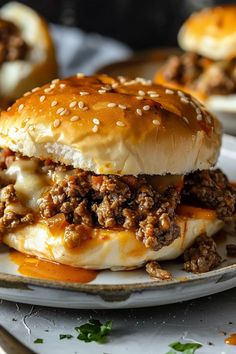 a cheeseburger on a plate with other burgers in the backround