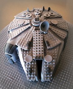 a cake made to look like a star wars battle ship with lots of holes in it