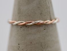 Two Tone Twist Ring 1.5mm  * Solid 14k Rose and Sterling Silver * 1.5mm thick * shiny polished finish * Available in other color combinations 14k SOLID Rose Gold and Sterling Silver band made of twisted wire. Band is 2 pieces of .8mm 14k gold. It is cut, bent, soldered, tumbled, and polished by me in my studio. Great stacking ring to mix and match with other rings, metals, or enjoy this delicate beauty solo. The combined width of this ring is about 1.5mm. Please write in your ring size in the no Mixed Metal Rings Wedding, Infinity Band Wedding Ring, Mixed Metal Wedding Band, Mixed Metals Wedding, Mixed Metal Ring, Twisted Band Ring, Band Wedding Ring, Simple Wedding Bands, Infinity Band