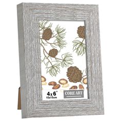 a wooden frame with pine cones and nuts