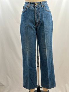 What is more 80s than Sergio Valente? In a medium denim wash, they have a straight leg, white stitch detailing and of course the iconic bull head embroidery. With a pair of oxfords and white tee, oh yes!  -80s Sergio Valente -Light wash, straight leg -Machine wash recommended  Measurements:  *Waist 14  1/2 inches *Hips 17 1/2 inches *Inseam 27 inches *Length 37 1/4  inches *This item is pre-loved and there may be minor flaws to the garment. Not to worry if there is anything major we will let you Classic Medium Wash Jeans With Contrast Stitching, Vintage Straight Leg Jeans With Contrast Stitching, Vintage Relaxed Fit Medium Wash Flare Jeans, Vintage Relaxed Fit Cropped Leg Jeans, Vintage Relaxed Fit Cropped Jeans, Vintage Denim Jeans With Cropped Leg, Vintage Cropped Leg Denim Blue Jeans, Vintage Cropped Leg Denim Jeans, Sergio Valente Jeans