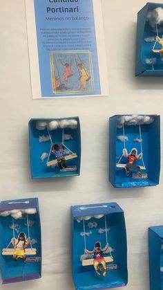 there are many small boxes with figurines hanging from them