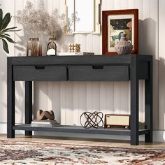 a console table with two drawers and a shelf below it on a rug in a living room