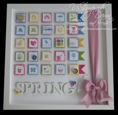 a greeting card with the word spring written on it and a pink bow hanging from the front