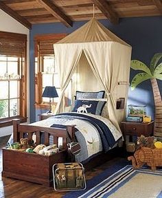 a child's bedroom decorated in blue and white