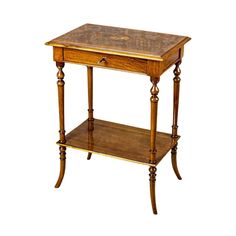 a small wooden table with a drawer on the top and shelf below it, against a white background