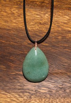 Wire-wrapped green aventurine pendant with a complimentary black cord. Green aventurine is a stone of luck. Faux Jewelry, Jade Pendant Necklace, Green Pendant, Photo Locket Necklace, Heart Photo, Green Pendants, Glendale Az, Jade Necklace, Photo Locket