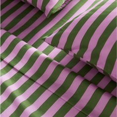 green and pink striped bedding with matching pillowcases on the bottom right hand side