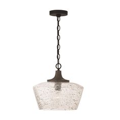 a glass light fixture hanging from a chain on an isolated ceiling lamp with black metal fittings