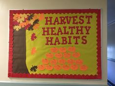 a bulletin board with writing on it that says harvest healthy habitts and an image of a tree