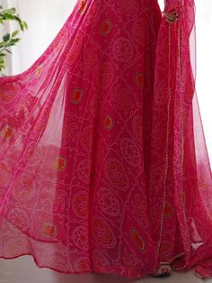 Introducing our stunning "pretty pink bandhani printed chiffon festival wear gown with dupatta" - a must-have for your festive wardrobe! This beautiful pink color gown features intricate bandhani print work, adding a touch of traditional charm. The chiffon fabric adds a touch of elegance, making it perfect for festivals, functions, and special events.
The matching chiffon dupatta with bandhani print work and fancy lace border work completes the look, giving you a coordinated and stylish outfit. Pink Sharara With Printed Motifs And Traditional Drape, Pink Dress With Printed Motifs For Navratri, Semi-stitched Floor-length Bandhani Salwar Kameez, Semi-stitched Floor-length Salwar Kameez With Bandhani Print, Traditional Pink Sharara With Printed Motifs, Festive Bandhani Print Maxi-length Dupatta, Festival Bandhani Print Maxi Salwar Kameez, Festival Bandhani Print Maxi Length Salwar Kameez, Festival Bandhani Print Salwar Kameez In Maxi Length