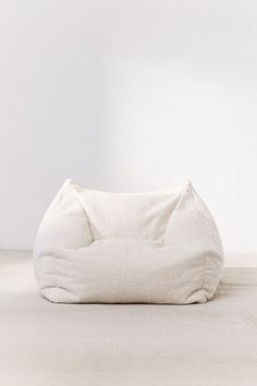 a white bean bag sitting on top of a floor