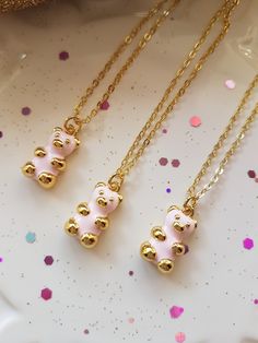 Just love this Adorable Teddy Bear necklace, such a cute little Teddy Bear. A lovely gift for the Girl of any age, it truly is a sweet Teddy Bear which is 18K Gold plated ( 18K Gold plated over Brass ) and Baby Pink coloured enamel to the front of the bear only. This Adorable Teddy Bear necklace is delightful and would make a wonderful present, Birthday Gift or a lovely Christmas present. The cable chain is a 18K Gold plated over copper and is 18 inch in length. The Teddy Bear charm is approx 17 Hypoallergenic Necklaces For Birthday And Valentine's Day, Cute Charm Necklaces With Adjustable Chain, White Charm Necklace For Valentine's Day Birthday Gift, Cute Adjustable Hypoallergenic Necklace, White Charm Necklace For Birthday On Valentine's Day, Cute Gold Jewelry For Mother's Day, Pink Jewelry With Adjustable Chain For Gift, Cute Silver Charm Necklaces For Party, Cute Jewelry For Valentine's Day Party