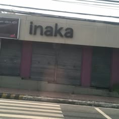 an image of a store front with the word inaka on it's side