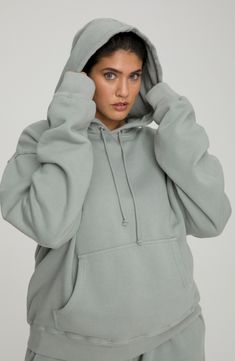 This cotton-knit hoodie offers plush comfort with an oversized fit that covers your backside and extra long sleeves. 27 1/2" length (size 5) Attached hood with drawstring Long sleeves Kangaroo pocket Ribbed accents Allover print 100% cotton Machine wash, tumble dry Made in USA Model stats: 5'10" height, 32" bust, 25" waist, 36" hip. Model is wearing size 5 Relaxed Fit Hooded Sweater With Ribbed Cuffs, Hooded Sweater With Ribbed Cuffs And Relaxed Fit, Relaxed Fit Hoodie With Drawstring For Loungewear, Relaxed Fit Hooded Cozy Sweats, Oversized Hoodie Sweater With Ribbed Cuffs, Cozy Solid Sweats With Drawstring Hood, Cozy Hooded Sweats With Relaxed Fit, Cozy Relaxed Fit Hooded Sweats, Comfortable Solid Sweats With Drawstring Hood