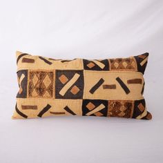 a decorative pillow made out of fabric on a white background with an abstract design in the middle