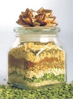 a glass jar filled with cereal and nuts